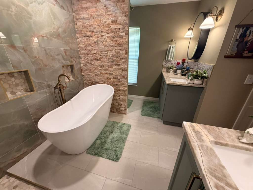 Freestanding Tub & Stone Wall — Bathrooms by American Apex Construction