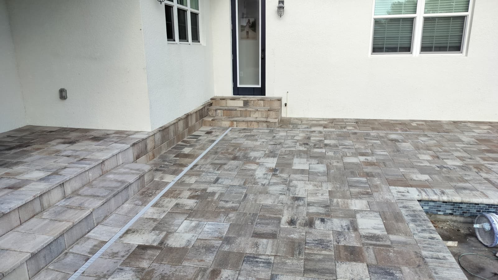 Completed paver patio project by American Apex Construction